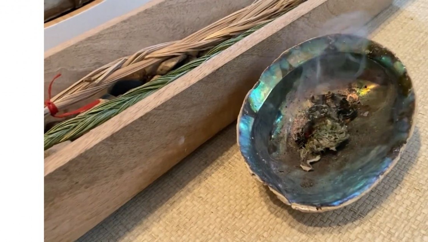 Sage burning in a smudge bowl