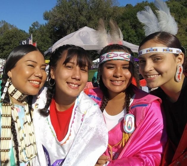 Ninijanisag youth in regalia at powwow