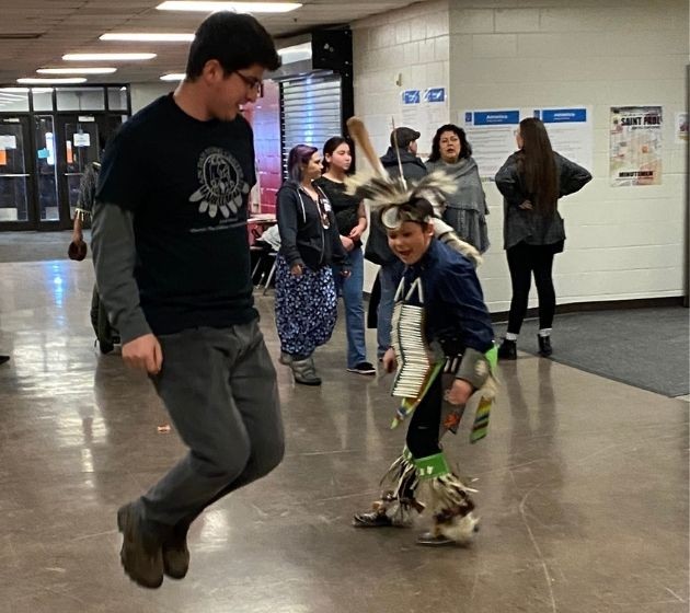 ADYC Staff playing a game with a young Native Indigenous boy